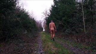 naked uncut, unmasked slave exposed in penis cage hiking in rain outdoor peeing dirty body writing BDSM CBT