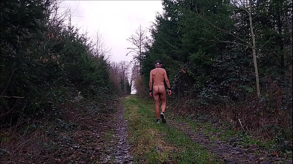naked uncut, unmasked slave exposed in penis cage hiking in rain outdoor peeing dirty body writing BDSM CBT