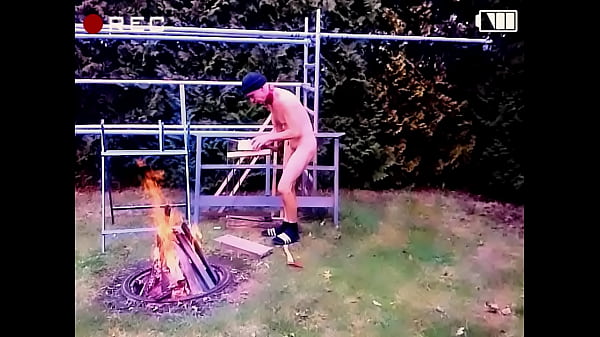 naked uncut, unmasked stupid slave exposed outdoor split wood at campfire for party enjoy the heat BDSM